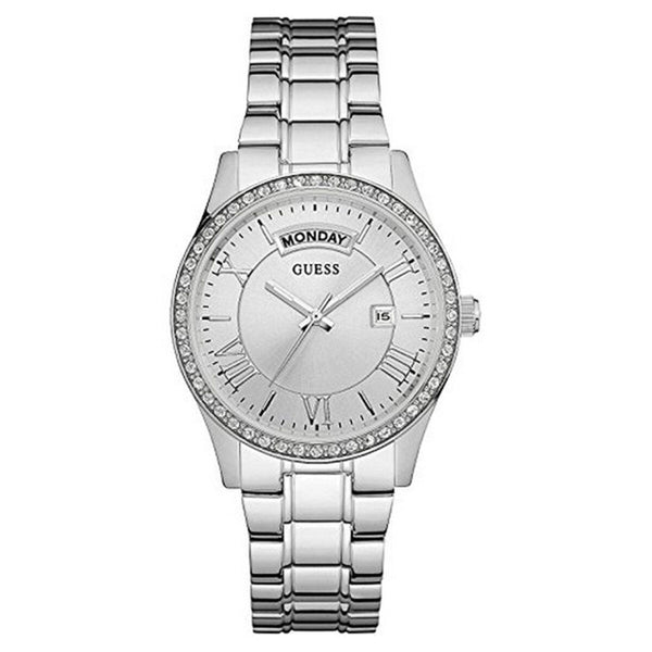 Montre féminine Guess en acier poli, cadran argenté orné de cristaux et affichage jour/date, Maison Mercier.