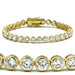 Détail d'un bracelet tennis en laiton doré, orné de zircons ronds serti clos, Maison Mercier.