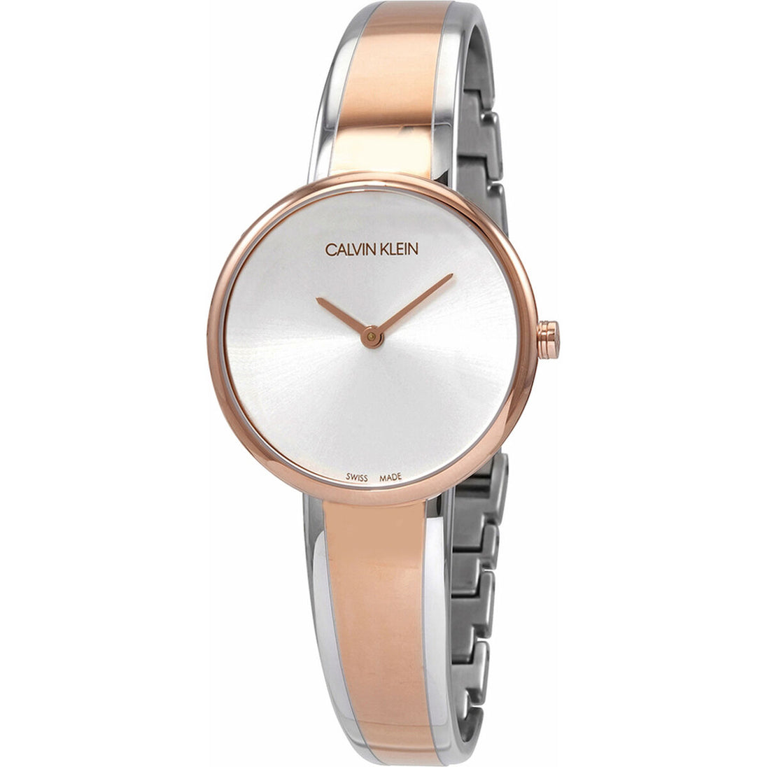 Montre femme Calvin Klein bicolore en acier poli et or rose, cadran argenté brossé minimaliste, Maison Mercier.