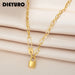 Collier gourmette ovale doré avec cadenas et épingle 'Love' en acier inoxydable, logo DIEURO en haut à gauche, sur un tissu soyeux beige, Maison Mercier.