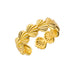 Détail d'une bague ajustable dorée en acier inoxydable, ornée d'un motif délicat de coquillages, Maison Mercier.
