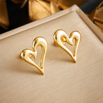 Paire de boucles d'oreilles créoles fines avec détails perlés en acier inoxydable doré, Maison Mercier.
