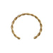 Bracelet jonc ouvert torsadé doré en acier inoxydable, présenté dans un écrin de velours rouge, avec une étiquette Saint Laurent et une carte Joyful Nails Studio.