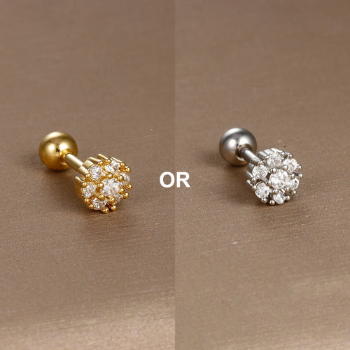 Collection de piercings d'oreille variés, en acier chirurgical doré et zircons, offrant une touche d'éclat discret, Maison Mercier.