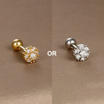 Collection de piercings d'oreille variés, en acier chirurgical doré et zircons, offrant une touche d'éclat discret, Maison Mercier.