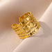 Bague ajustable multi-rangs avec motif de croix sertie de zircons en acier inoxydable doré, Maison Mercier.