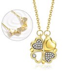 Collier pendentif transformable cœurs trèfle en acier doré et zirconia, présenté ouvert en ligne de cœurs et fermé en trèfle, sur fond bleu profond, Maison Mercier.