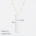 Vue détaillée du collier lariat Y doré avec ses perles, indiquant une longueur de chute de 10cm et un diamètre de perle de 0.5cm, poids 5.1g, longueur totale 40+5cm.