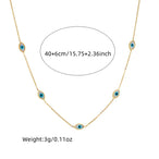 Détail d'une parure collier et puces d'oreilles arbre de vie en acier doré et zircons, Maison Mercier.