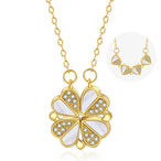 Collier pendentif transformable cœurs trèfle en acier doré et zirconia, présenté ouvert en ligne de cœurs et fermé en trèfle, sur fond bleu profond, Maison Mercier.