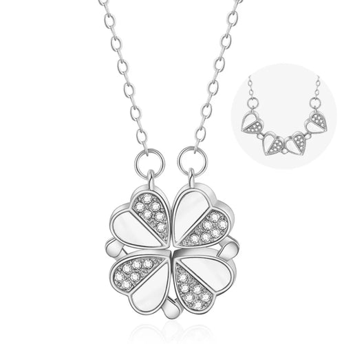 Collier pendentif transformable cœurs trèfle en acier doré et zirconia, présenté ouvert en ligne de cœurs et fermé en trèfle, sur fond bleu profond, Maison Mercier.