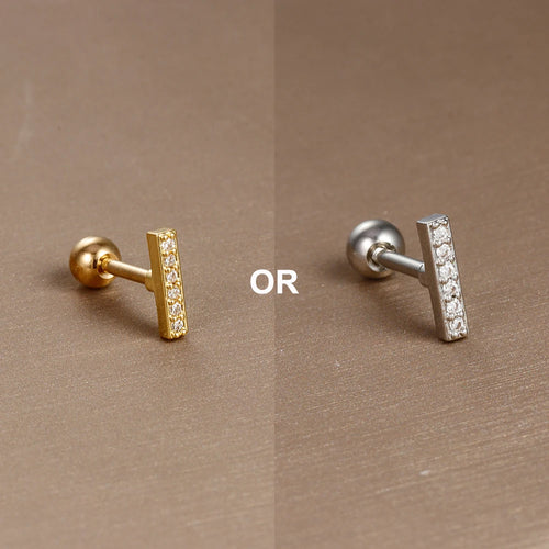 Piercing d'oreille en acier 316L doré, avec un zircon central brillant, idéal pour le cartilage ou le lobe.