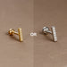 Piercing d'oreille en acier 316L doré, avec un zircon central brillant, idéal pour le cartilage ou le lobe.