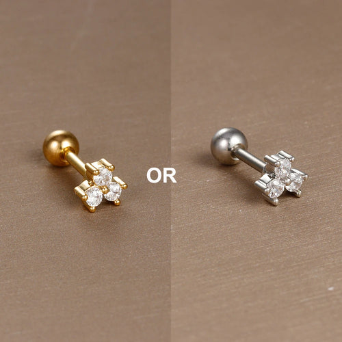 Piercing d'oreille fleur à cinq pétales en zircons, en acier chirurgical doré, présenté dans un écrin beige raffiné, Maison Mercier.
