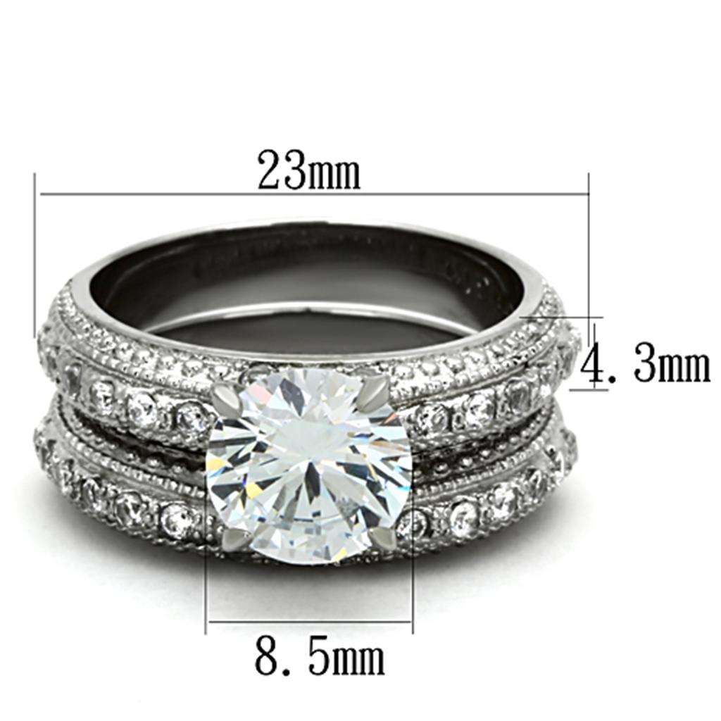 Vue de dessus d'une parure de bagues en acier inoxydable avec zircons, présentant les dimensions techniques de 23mm, 4.3mm et 8.5mm.