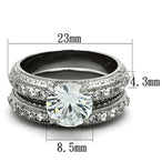 Vue de dessus d'une parure de bagues en acier inoxydable avec zircons, présentant les dimensions techniques de 23mm, 4.3mm et 8.5mm.