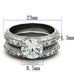 Vue de dessus d'une parure de bagues en acier inoxydable avec zircons, présentant les dimensions techniques de 23mm, 4.3mm et 8.5mm.