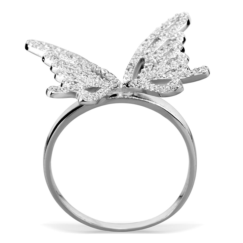 Profil élégant d'une bague papillon en argent rhodié, révélant la finesse de sa monture, Maison Mercier.