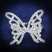 Détail d'une bague papillon en argent rhodié ornée de zircons scintillants, Maison Mercier.