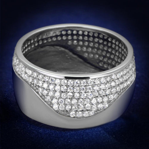 Vue de face d'une bague bande large en argent massif rhodié, ornée d'un pavage ondulant de zircons scintillants, Maison Mercier.